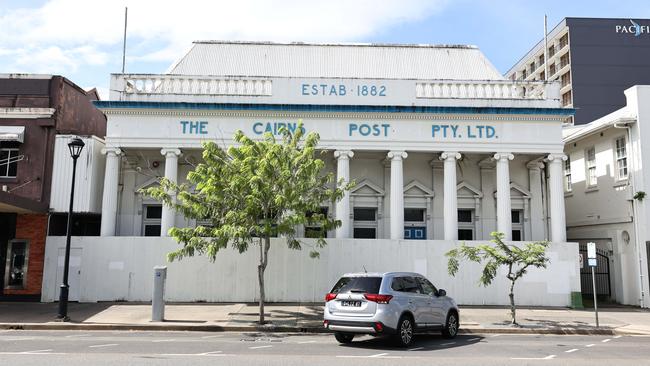 The former Cairns Post office, built in 1908 on Abbott Street, has been boarded up for years awaiting redevelopment. Mould is growing throughout the building, and vegetation has started to grow in the cracks of the famous columned facade. Picture: Brendan Radke