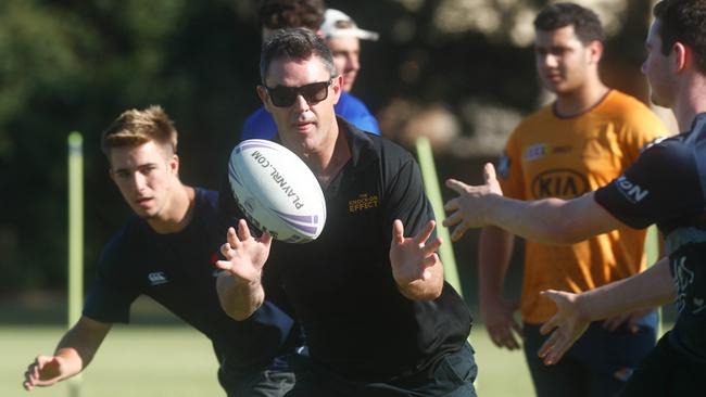 Brad Fittler playing footy with the kids from the Marist Brothers Rams who lost teammates Eddie Allen and Jaylan Stewart in separate road accidents this year. Picture: Danielle Smith