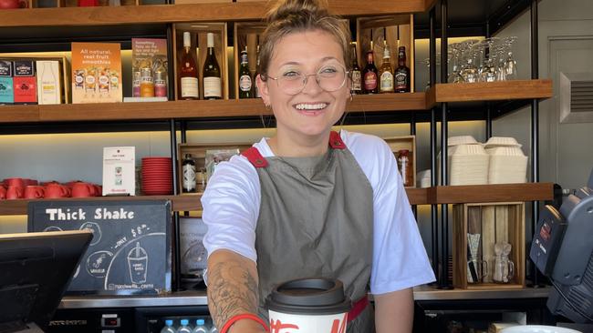 Macchinetta barista Fanni Van Osselaer serving customers a drink in time for borders to open. Picture: Andreas Nicola