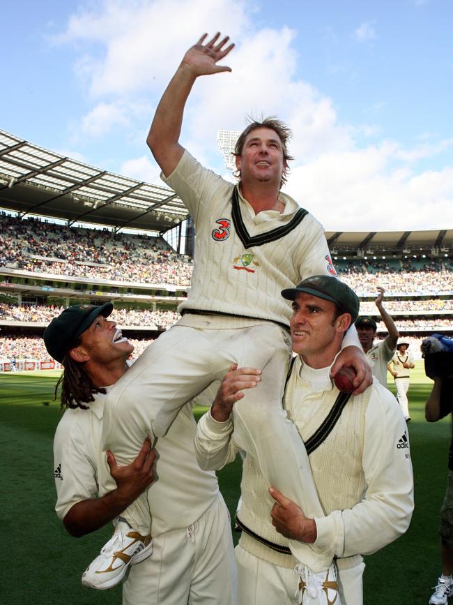 Warnie gets carried off by Andrew Symonds and Matthew Hayden.