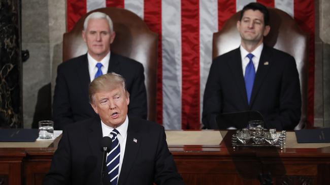 Vice President Mike Pence and House Speaker Paul Ryan. listen as President Donald Trump addresses a joint session of Congress. Picture: AP