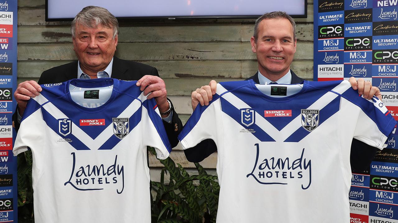 Arthur Laundy and Bulldogs chief executive Andrew Hill celebrate Canterbury’s new sponsorship deal with Laundy Hotels. Picture: Brett Costello