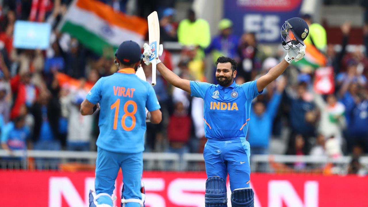 Rohit Sharma (r) of India celebrates reaching his century with captain Virat Kohli