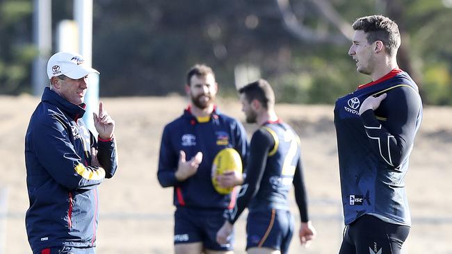 Departed Crows Don Pyke in a frank discussion with forward Josh Jenkins. Picture SARAH REED