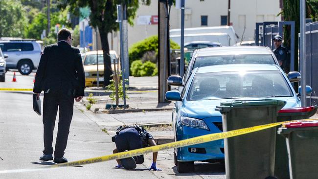 An officer searches for evidence along Dunorlan Road in Edwardstown, where the man was found. Picture: NCA NewsWire / Brenton Edwards