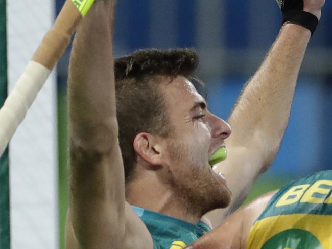 Australia's Jacob Whetton, left, celebrates his goal against Britain during a men's field hockey match at 2016 Summer Olympics in Rio de Janeiro, Brazil, Wednesday, Aug. 10, 2016. (AP Photo/Hussein Malla)