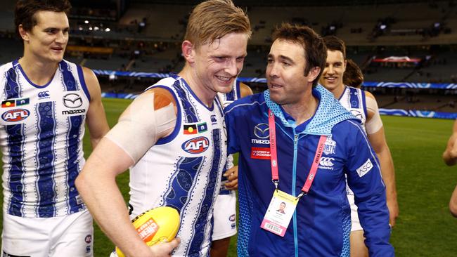 Brad Scott embraces Jack Ziebell after his final win over the Western Bulldogs. Picture: Getty Images