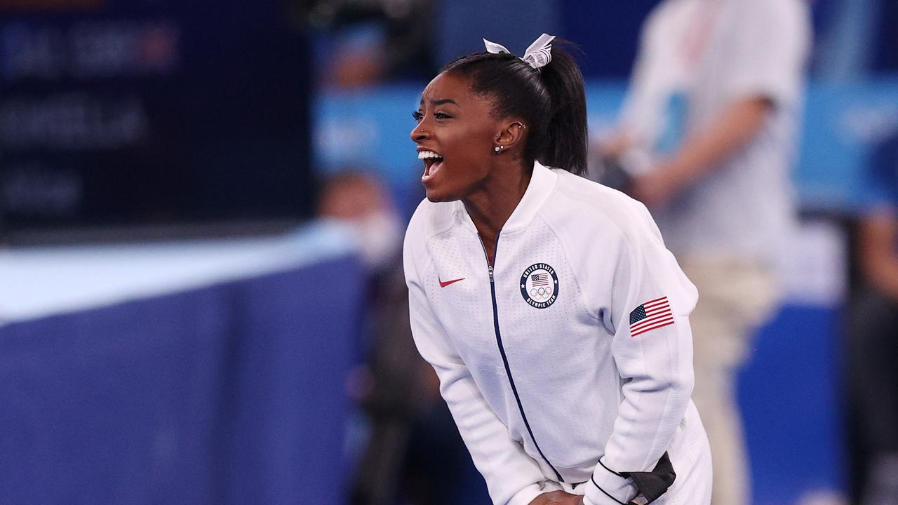 TOKYO, JAPAN - JULY 27: Simone Biles of Team United States cheers as Jordan Chiles (not pictured) competes in floor routine during the Women's Team Final on day four of the Tokyo 2020 Olympic Games at Ariake Gymnastics Centre on July 27, 2021 in Tokyo, Japan. (Photo by Ezra Shaw/Getty Images)