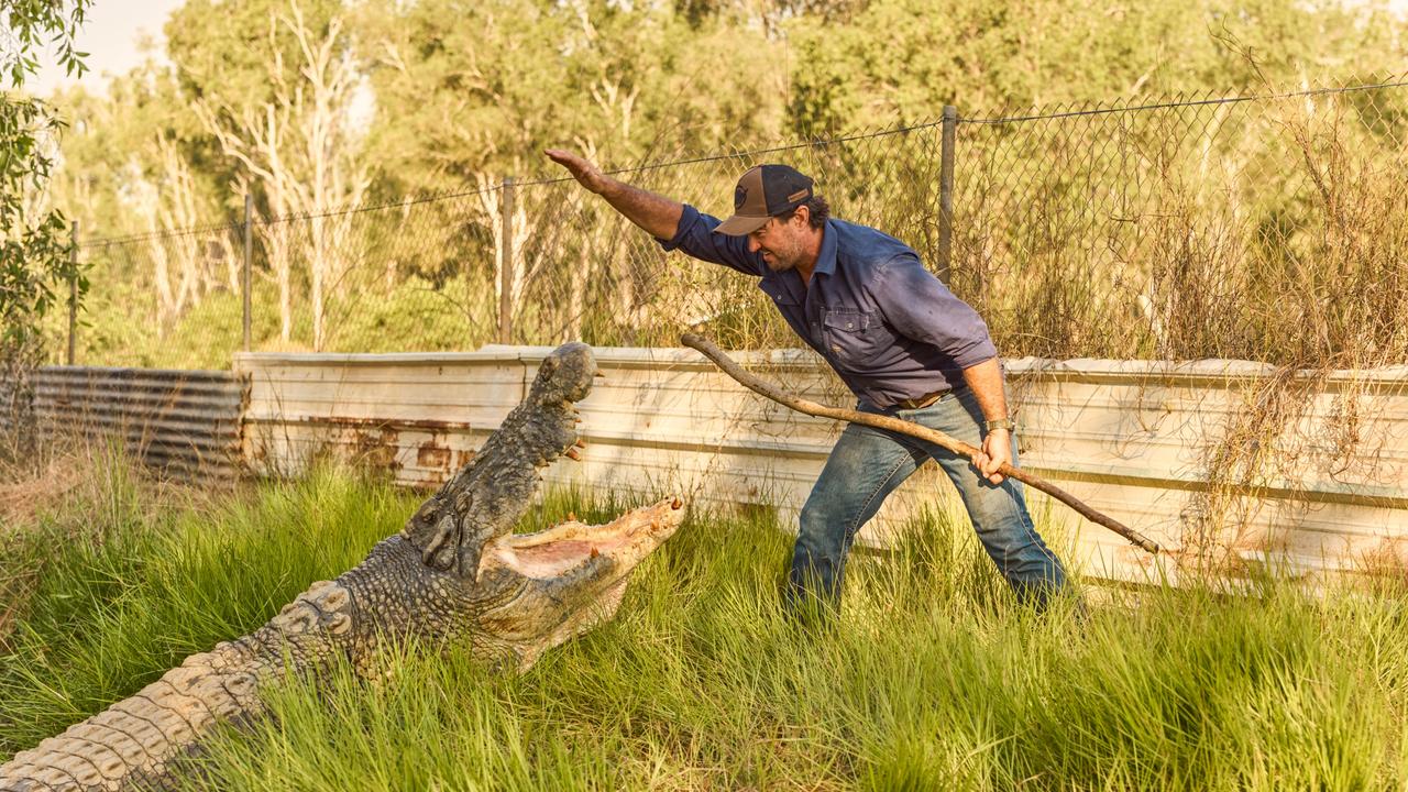 Matt Wright with a rescue crocodile at Top End Safari Camp.