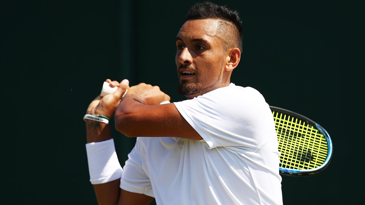 Nick Kyrgios hits a double-handed backhand against Denis Istomin.