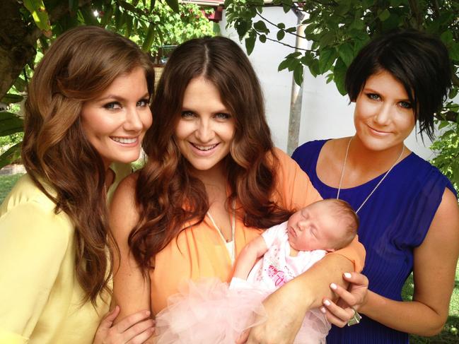 The McClmont sisters Sam (left) and Mollie (right), with sister Brooke and her baby Tiggy.