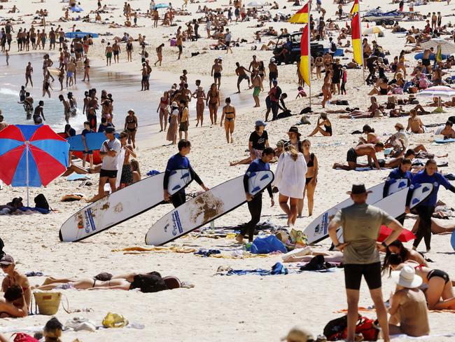 Sun seekers at Bondi Beach pictured enjoying the surf during a heatwave in Sydney. Picture: Sam Ruttyn