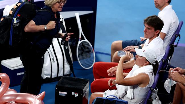 Iga Swiatek receives medical attention in the United Cup final. Picture: Brendon Thorne/Getty Images