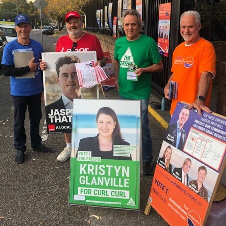 Volunteer election workers outside Dee Why Public School: (left to right) Gary Hatcher (Vince De Luca Independents); Andre Volkov (Labor); Mark Baxter (the Greens) and; Mark Jeffs (Your Northern Beaches independent Team). Picture: Jim O’Rourke