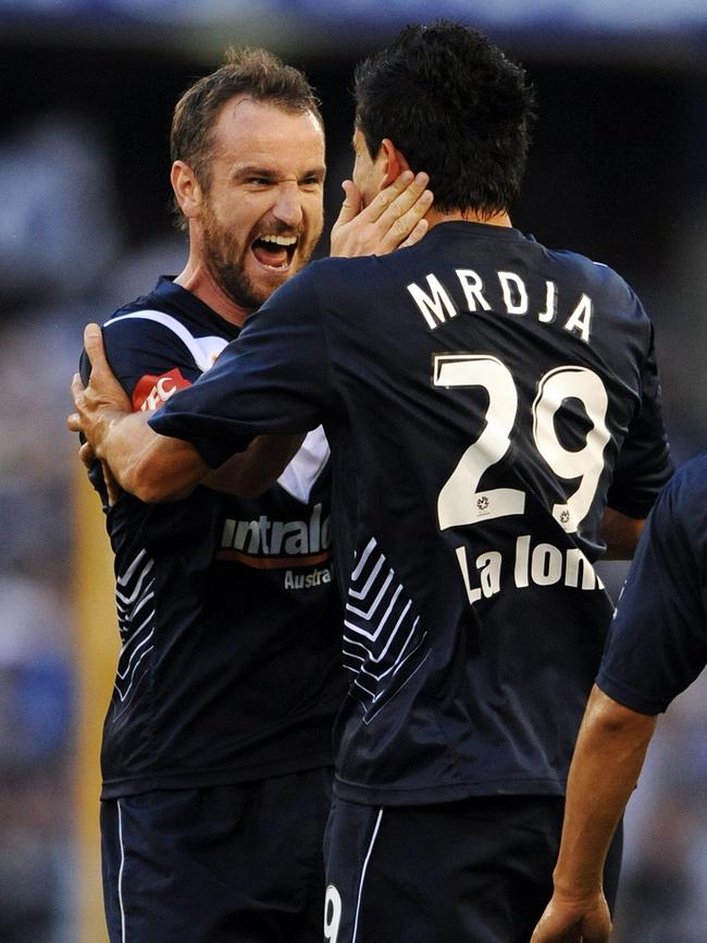 Grant Brebner celebrates with Nik Mrdja in 2010. Picture: Michael Dodge