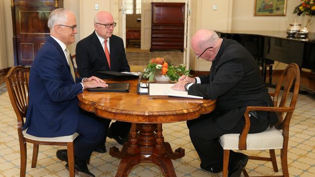 The Governor-General, Sir Peter Cosgrove receiving the Prime Minister Malcolm Turnbull and Attorney-General, Senator the George Brandis for the assent of the Marriage Amendment (Definition and Religious Freedoms) Bill 2017, at Government House in Canberra. Picture: Kym Smith