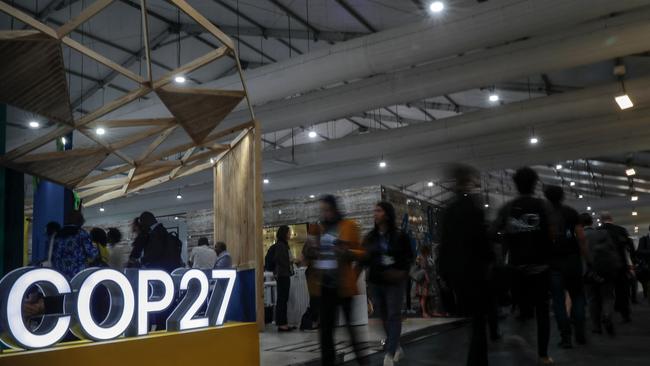 Participants walk inside the Sharm el-Sheikh International Convention Centre during the COP27 climate conference, in Egypt's Red Sea resort city.