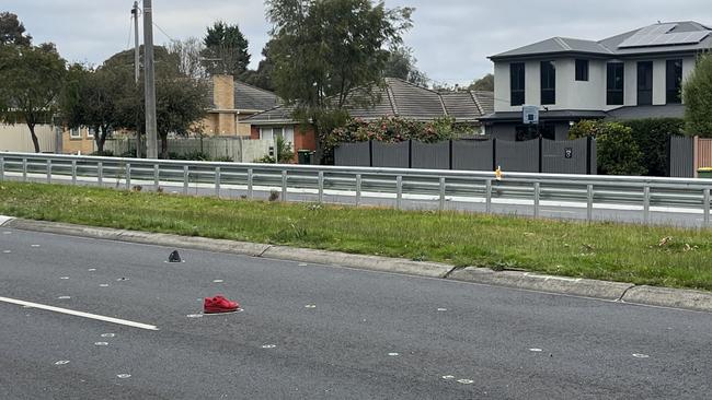 A red Nike shoe seen at the crime scene in Bayswater. Picture: Erin Constable