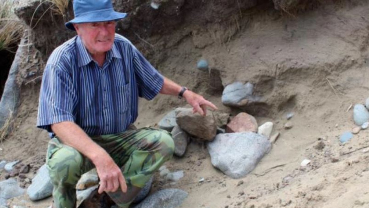 Alan Clark, of Greenhills, points to the pile of rocks which now covers the spot where he came across a cranium. Picture: Jenet Gellatly
