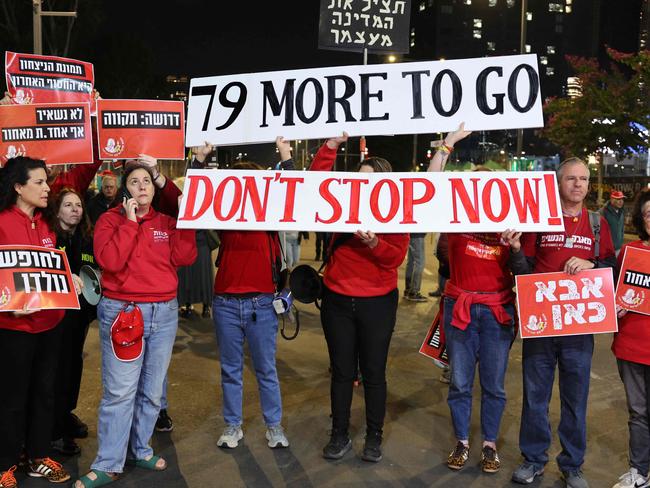 Demonstrators raise placards during a protest calling for the release of hostages held captive in Gaza since the October 7, 2024 attack by Palestinian militants, in front of the Israeli Defence Ministry in Tel Aviv on February 1. Picture: Jack Guez/AFP