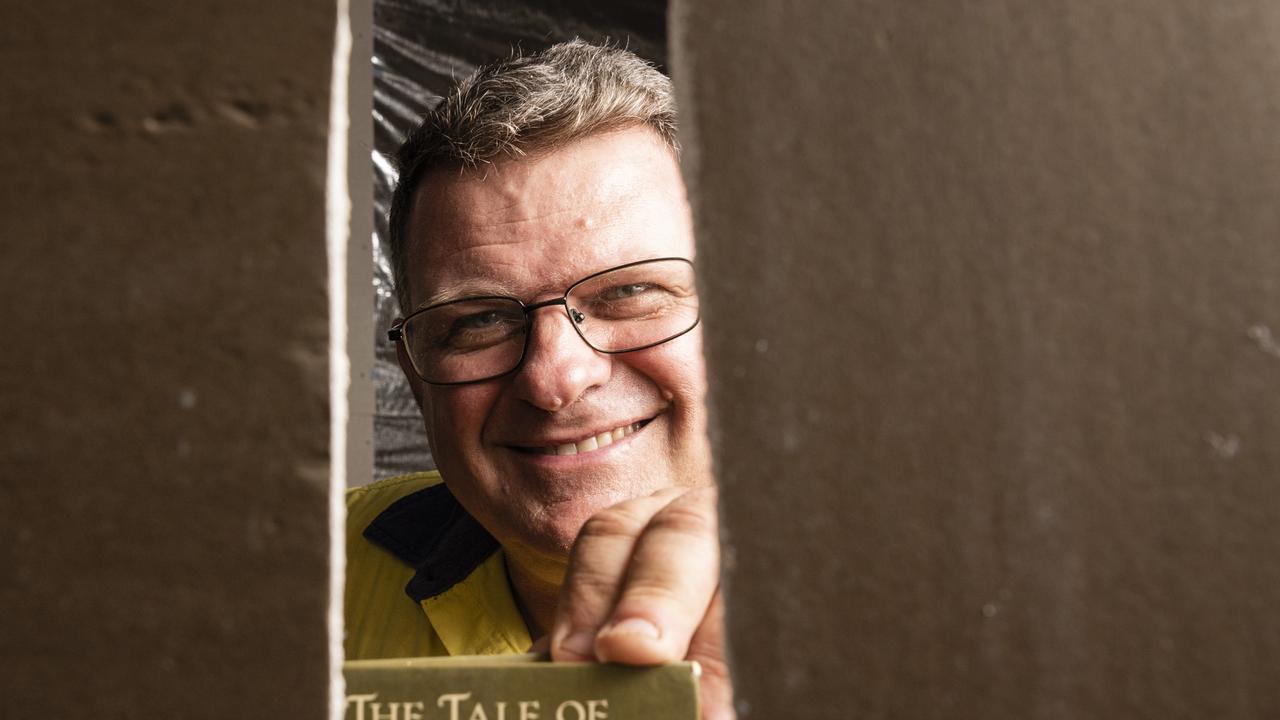 Andrew Fletcher found a Beatrix Potter book with a message written in it in a wall while renovating his Toowoomba home. Picture: Kevin Farmer