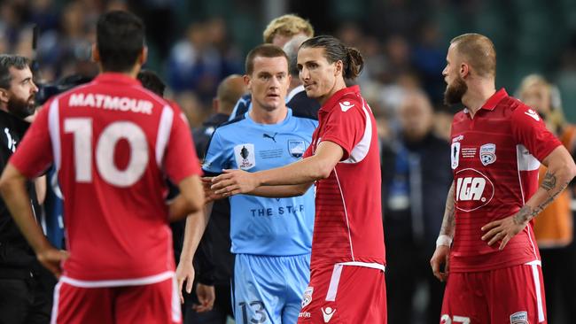 Adelaide United’s Michael Marrone leaves the pitch after being sent off following the ball-boy incident at Allianz Stadium. Picture: AAP Image/David Moir