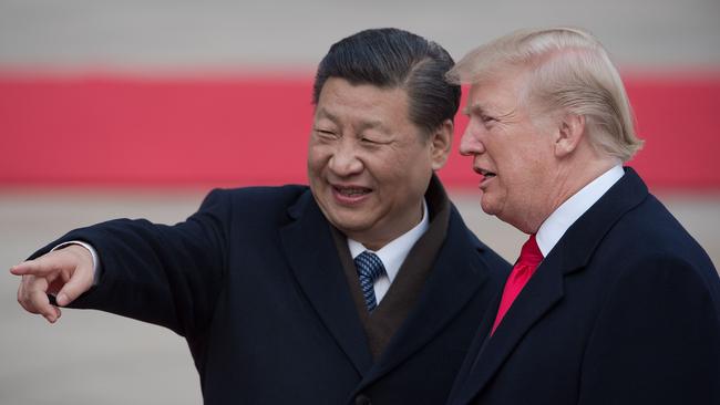 China's President Xi Jinping (L) and US President Donald Trump attend a welcome ceremony in Beijing last year.