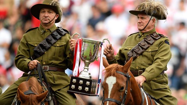 Light Horse Brigade reenactors deliver the Anzac Day trophy ahead of yesterday’s NRL match between the St George Illawarra Dragons and the Sydney Roosters at Allianz Stadium. Picture: Dan Himbrechts/AAP