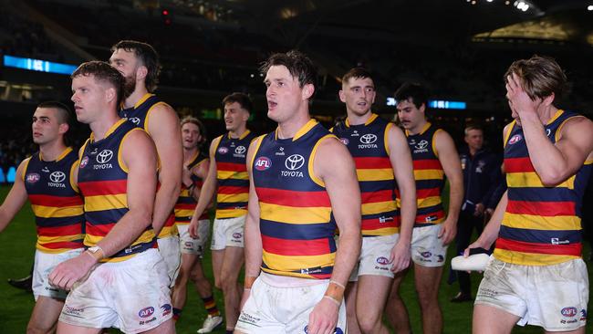 Crouch leaving the field with teammates before the alleged incident. Picture: Sarah Reed/AFL Photos via Getty Images