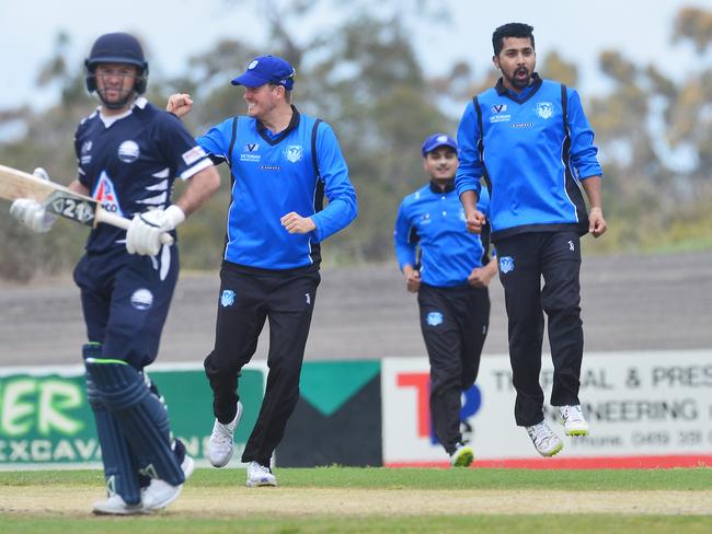 Sunam Gautam (right) celebrates a wicket against Geelong. Picture: Rob Leeson.