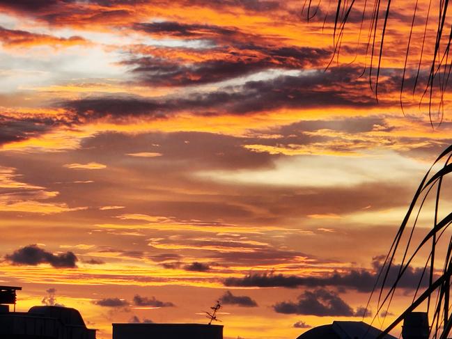 The sky comes alive in sunset over Casuarina Shopping Centre in Darwin. Picture: Janice Warren