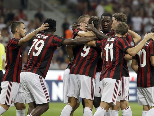 AC Milan players celebrate.