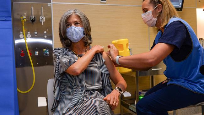 Nicola Spurrier gets her second vaccine from Registered Nurse Tovah Green at the RAH. Picture: Brenton Edwards