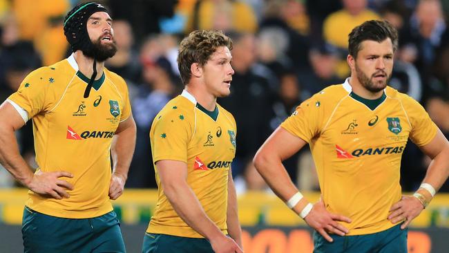 Wallabies players leave the field after the heavy loss. Picture: Mark Evans