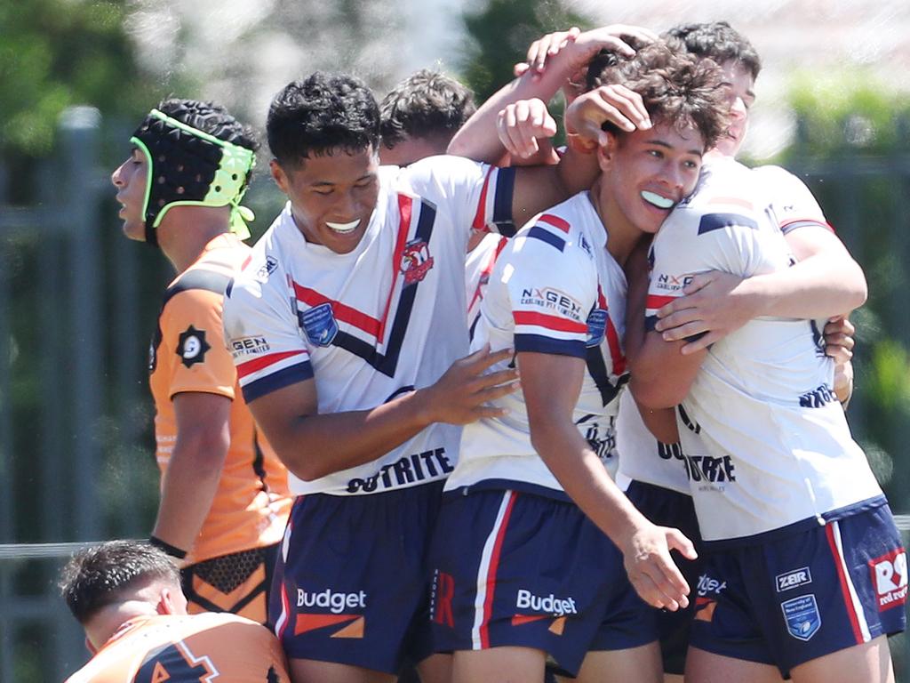 Roosters players celebrate. Picture: Sue Graham