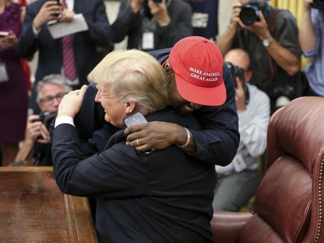 Rapper Kanye West hugs Donald Trump during a meeting in the Oval office in 2018. Picture: Getty Images