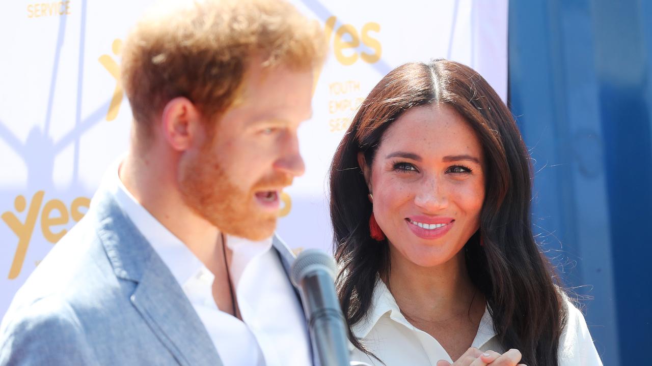 Meghan looks on as Prince Harry speaks during a visit a township to learn about Youth Employment Services in Johannesburg. Picture: Chris Jackson/Getty Images