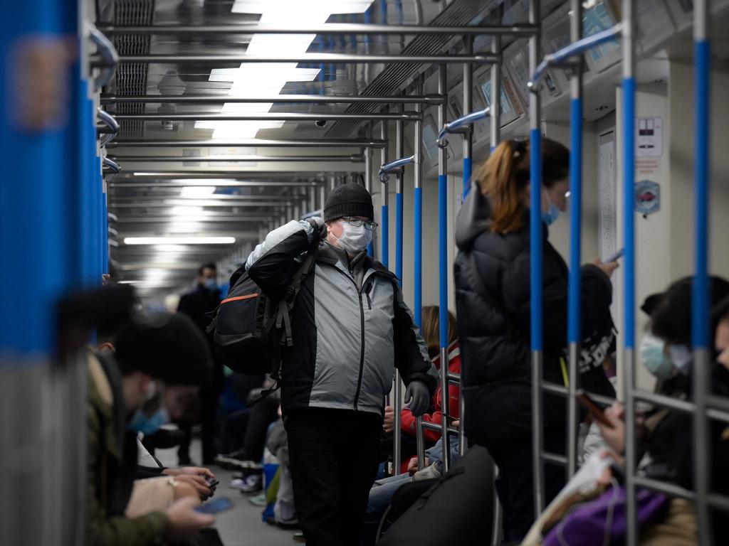 Passengers, wearing face masks, commute in a metro train in Moscow. Picture: AFP