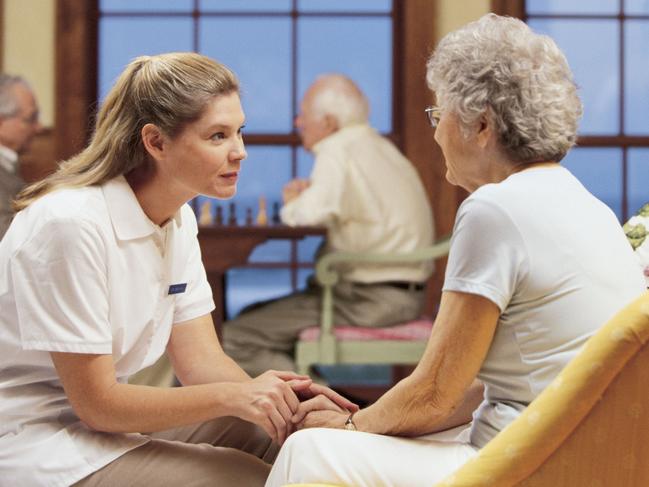 Generic pic of a nurse talking to a woman in a nursing home.