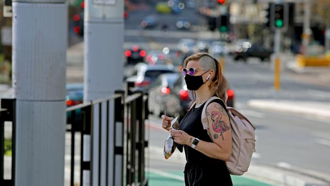 Health advice in NSW was upgraded on Sunday to ‘strongly encourage’ mask wearing in shopping centres, places of worship, on public transport and at other indoor gatherings. Picture: NCA NewsWire / Nicholas Eagar