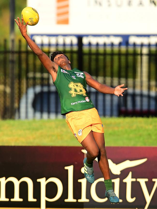 St Mary’s product Maurice Rioli Jr stretches high to take a mark. Picture: Justin Kennedy