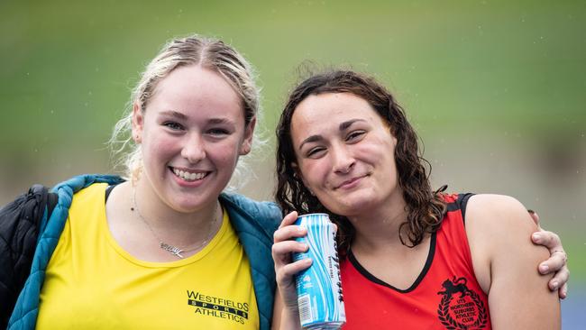 Molly Goetz from Smithfield with a friendly rival after the women’s U18 Hammer Throw at Sydney Olympic Park.