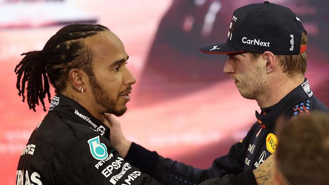 Race winner and 2021 F1 World Drivers Champion Max Verstappen of Netherlands and Red Bull Racing is congratulated by runner up in the race and championship Lewis Hamilton of Great Britain and Mercedes GP during the F1 Grand Prix of Abu Dhabi. Picture: Lars Baron/Getty Images