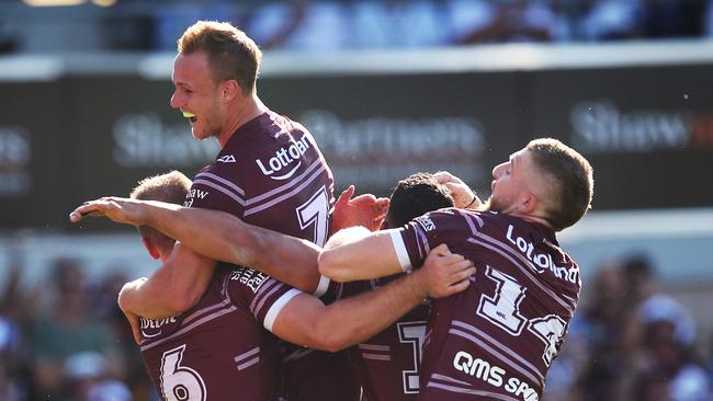 Lachlan Croker is mobbed by Daly Cherry-Evans and Sea Eagles teammates after scoring a try against the Eels. Picture: Phil Hillyard