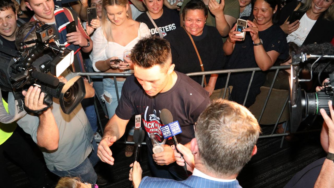 Retiring halfback Cooper Cronk is mobbed by media after winning the grand final. Dean Asher.