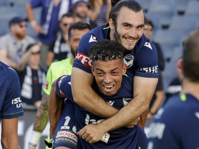 Ben Folami (bottom) celebrates with then Victory teammate Nick D'Agostino in December, 2022. Picture: Jenny Evans/Getty Images