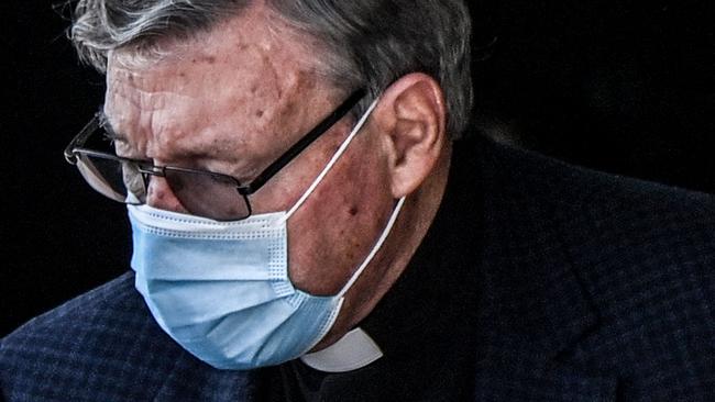 Australian Cardinal George Pell gets into a car after landing at Rome's Fiumicino airport on September 30, 2020, returning for the first time since being acquitted of sexual abuse charges. - Pell arrived from Sydney to Rome on September 30, 2020 on a "private visit", just six months after Australia's High Court quashed his conviction on charges of molesting two choirboys in the 1990s. (Photo by Alberto PIZZOLI / AFP)