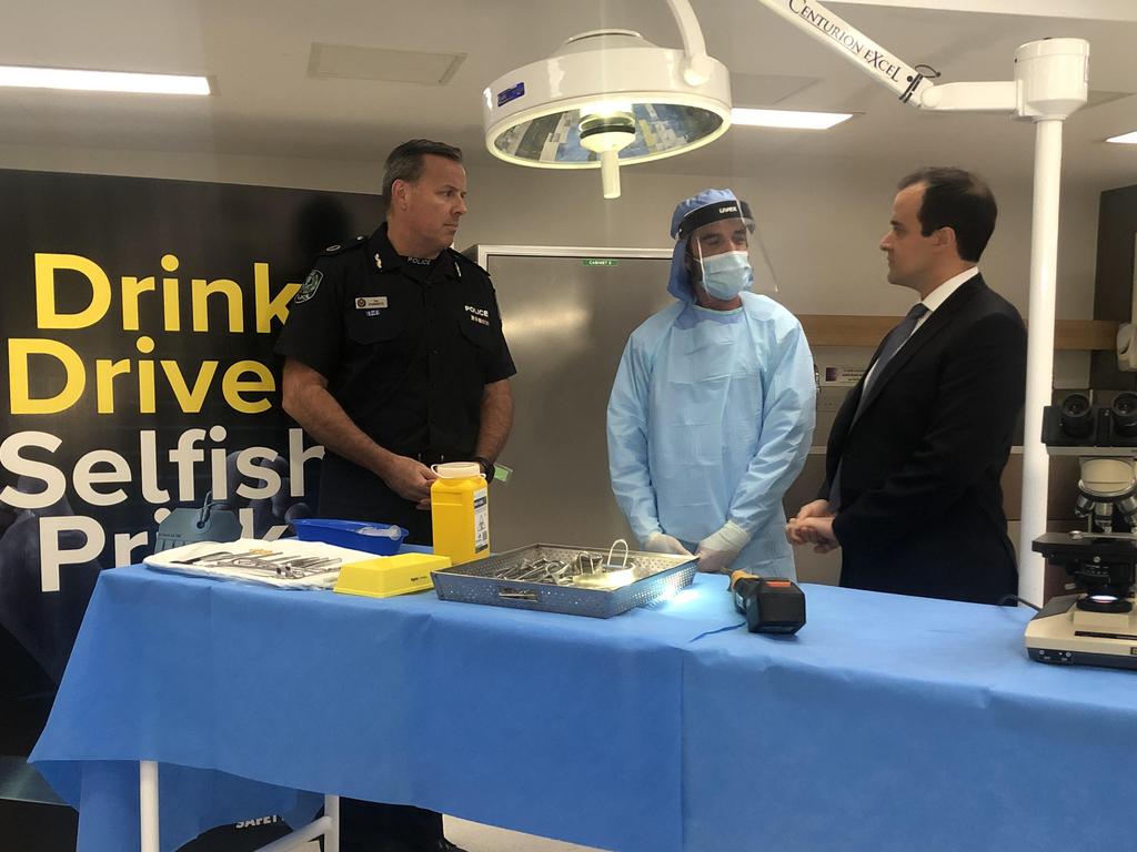 Assistant Commissioner Ian Parrott (left) with Police and Emergency Services Minister Vincent Tarzia in a morgue as they unveil the blunt campaign. Picture: Emily Cosenza