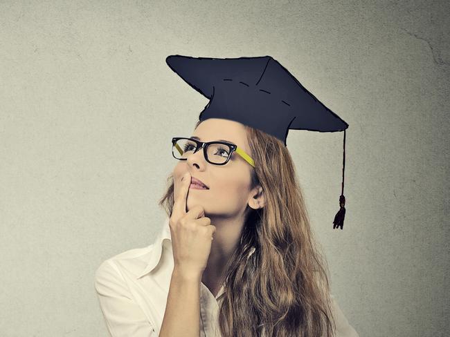 Portrait closeup beautiful thoughtful graduate graduated student girl young woman in cap gown looking up thinking isolated gray wall background. Graduation ceremony future career concept