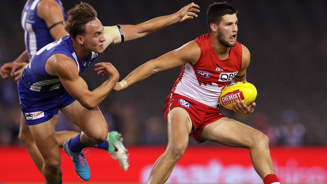 Nic Newman fends off Ryan Clarke at Etihad Stadium.